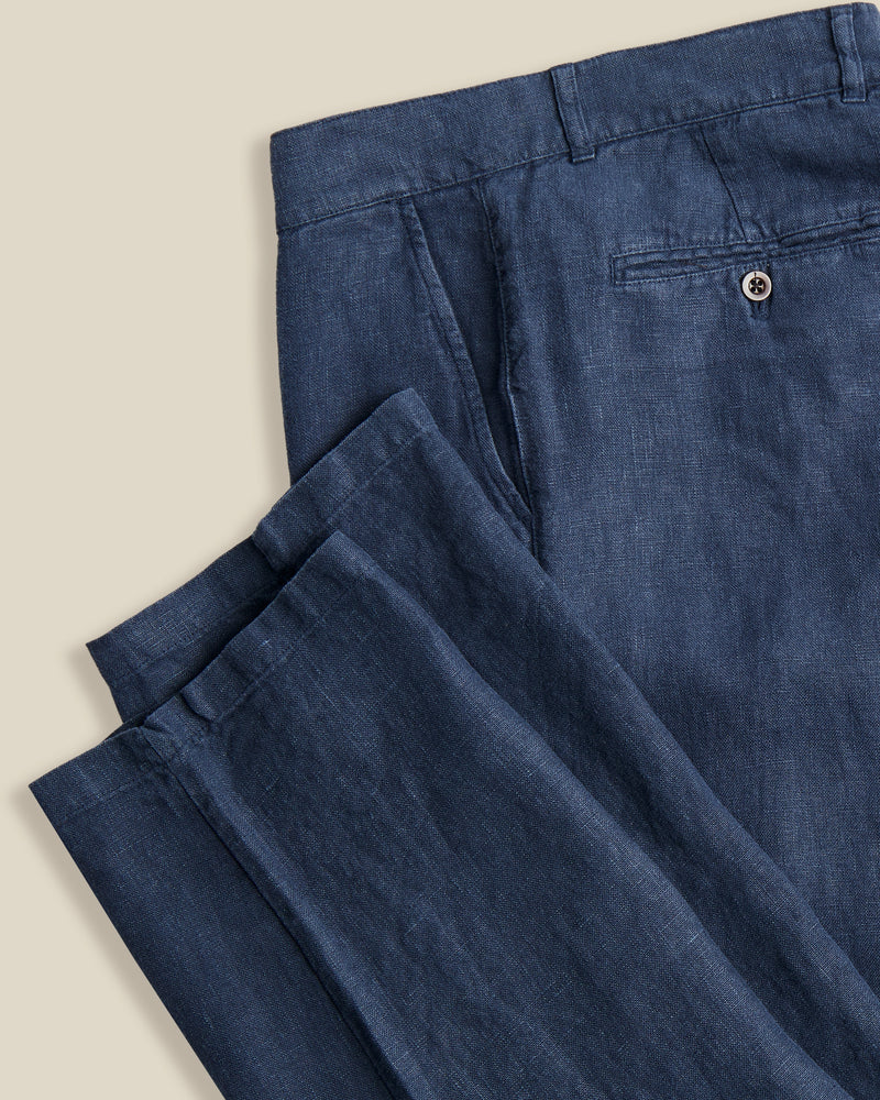 Portuguese Flannel's trousers are made from linen that's milled in Guimarães; the brand's home since 1927. Dyed navy, they're cut in a neat, straight-leg shape and have a little coin pocket by the waistband. Lower Impact Materials. This product is made using at least 50% lower-impact materials or ingredients.