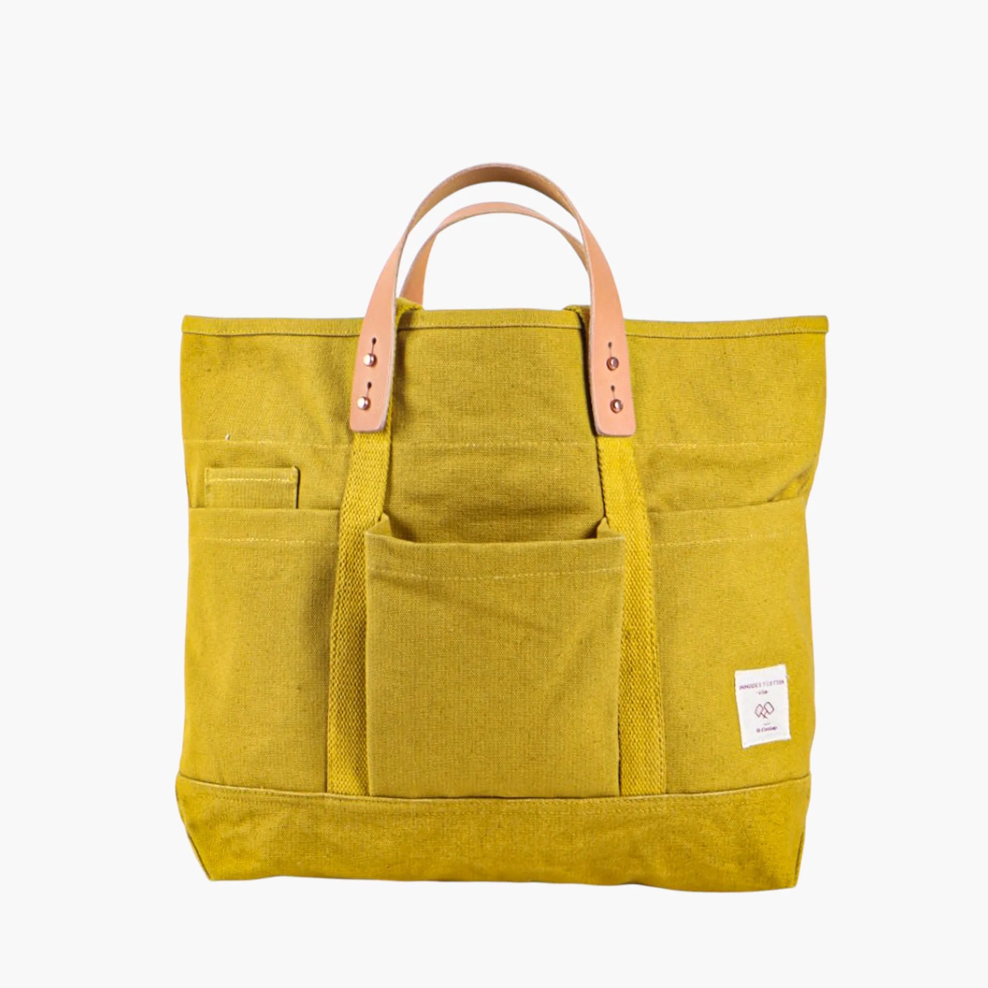 Tuck away your water bottle and keys in the front pockets, your paint brushes in the inside pocket. The Construction Tote is the same size as our Small East West Tote but with more hiding places.

• Converts from handheld to shoulder with detachable leather handles
• Once the handles are removed, the tote is washable
• All seams are double stitched and bound with cotton on the inside
• Two interior pockets and three exterior pockets
• Leather handles will patina over time with exposure to the sun and the oi