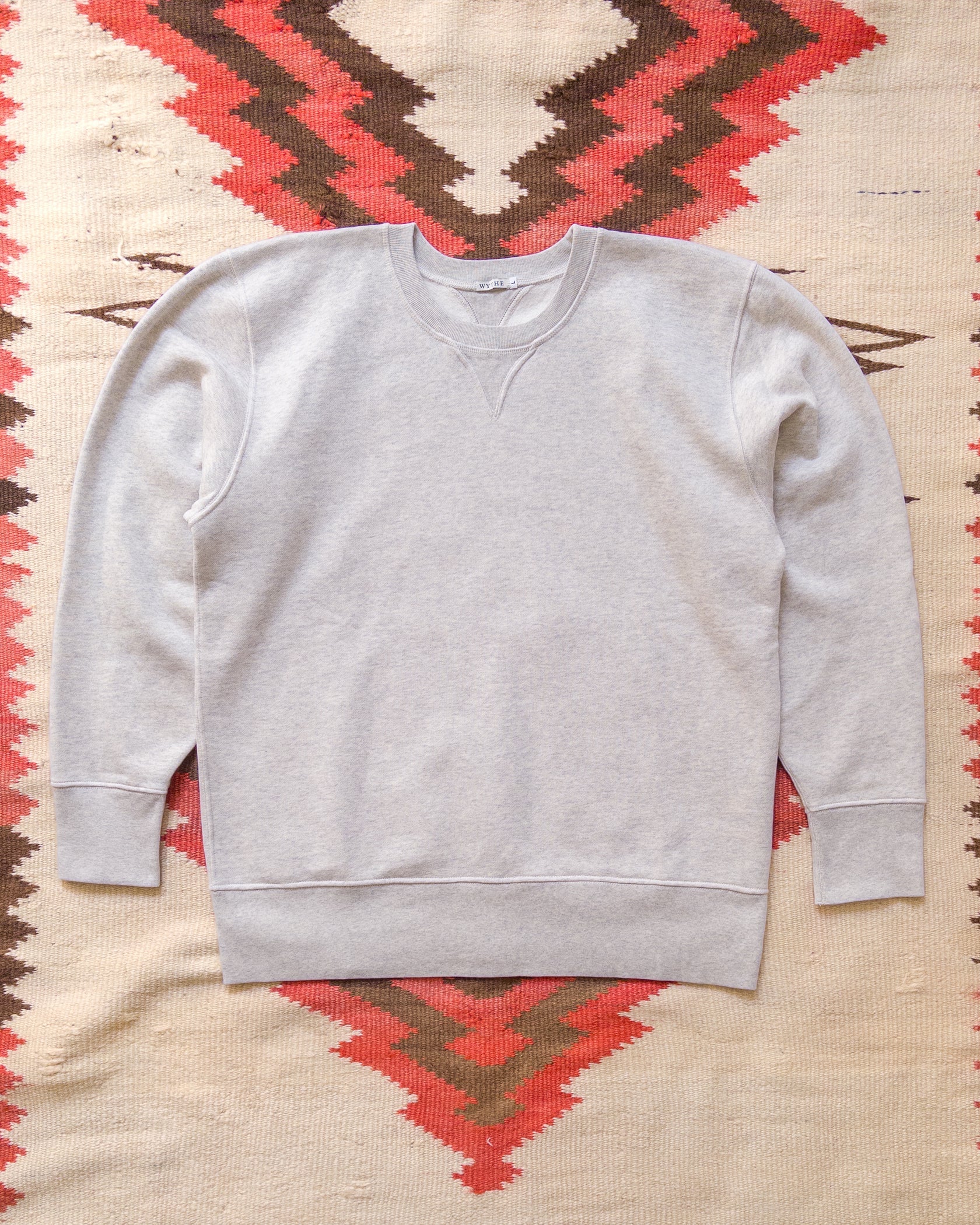 Cotton Sweatshirts were first used as athletic garments in the 1920s and 30s and always featured full length ribknit cuffs and hems, and V-shaped inserts in the neckline. The Wythe Sweatshirt stays true to these details, and adds a subtle curve into the V insert (lovingly called "Doritos" by some vintage aficionados) that gracefully matches the curve of the neckline.

Our crewneck sweatshirt has been a Wythe staple from the very beginning and was one of our earliest products. White we really loved the slimm