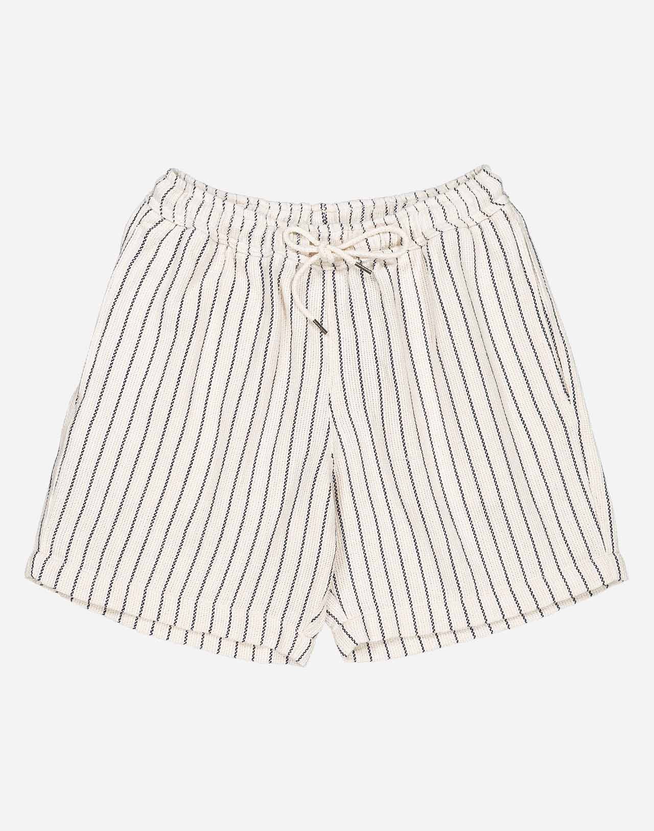 A summer wardrobe essential. With its elasticated waistband, loose fit, mid-thigh length, and soft cotton fabric enhanced by tonal topstitching, once you try the Bodhi shorts, you'll never look back (and they come in several colors and materials, for almost every day of the week).