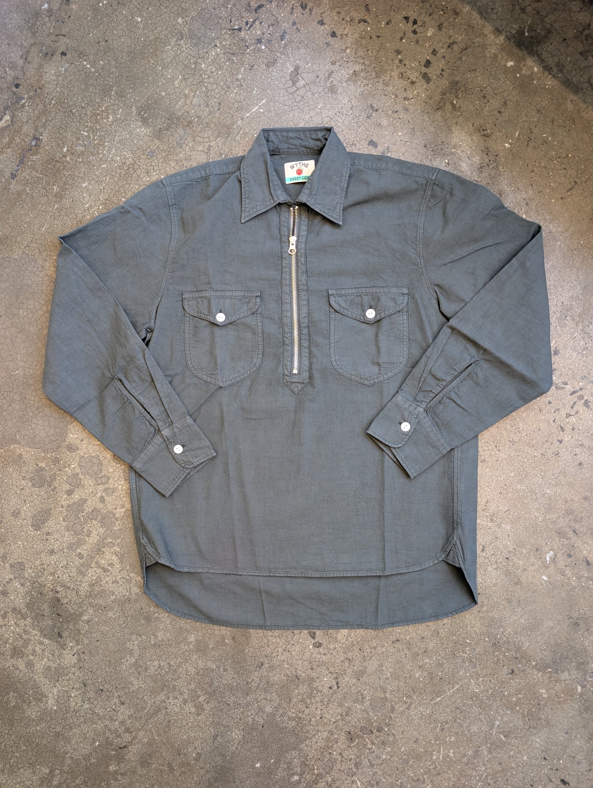 Through the countless hours we've spent pouring over our archival garments and historical photographs, we found ourselves up to our ears in beautiful vintage half-zip workshirts. Rather than going after a 1-to-1 recreation of those beauties, we decided to put a fun little spin on the half-zip shirt.

Using the same cotton fleece from our crewneck sweatshirts, we came up with this variation of a sweatshirt. Designed to be worn as a shirt, sweatshirt/sweater, or something in between, the half-zip sweatshirt i