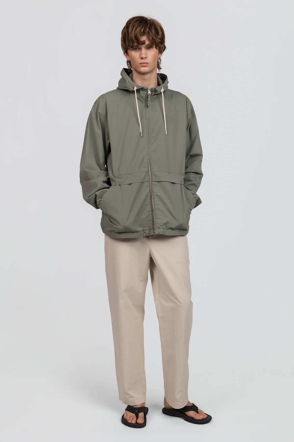 The Coastal Zip Jacket is crafted from our signature pop twill with a dry hand feel — exceptionally lightweight, breathable, and softly structured. Designed with a relaxed silhouette, it features oversized slash pockets and a double zipper closure for versatile styling.
