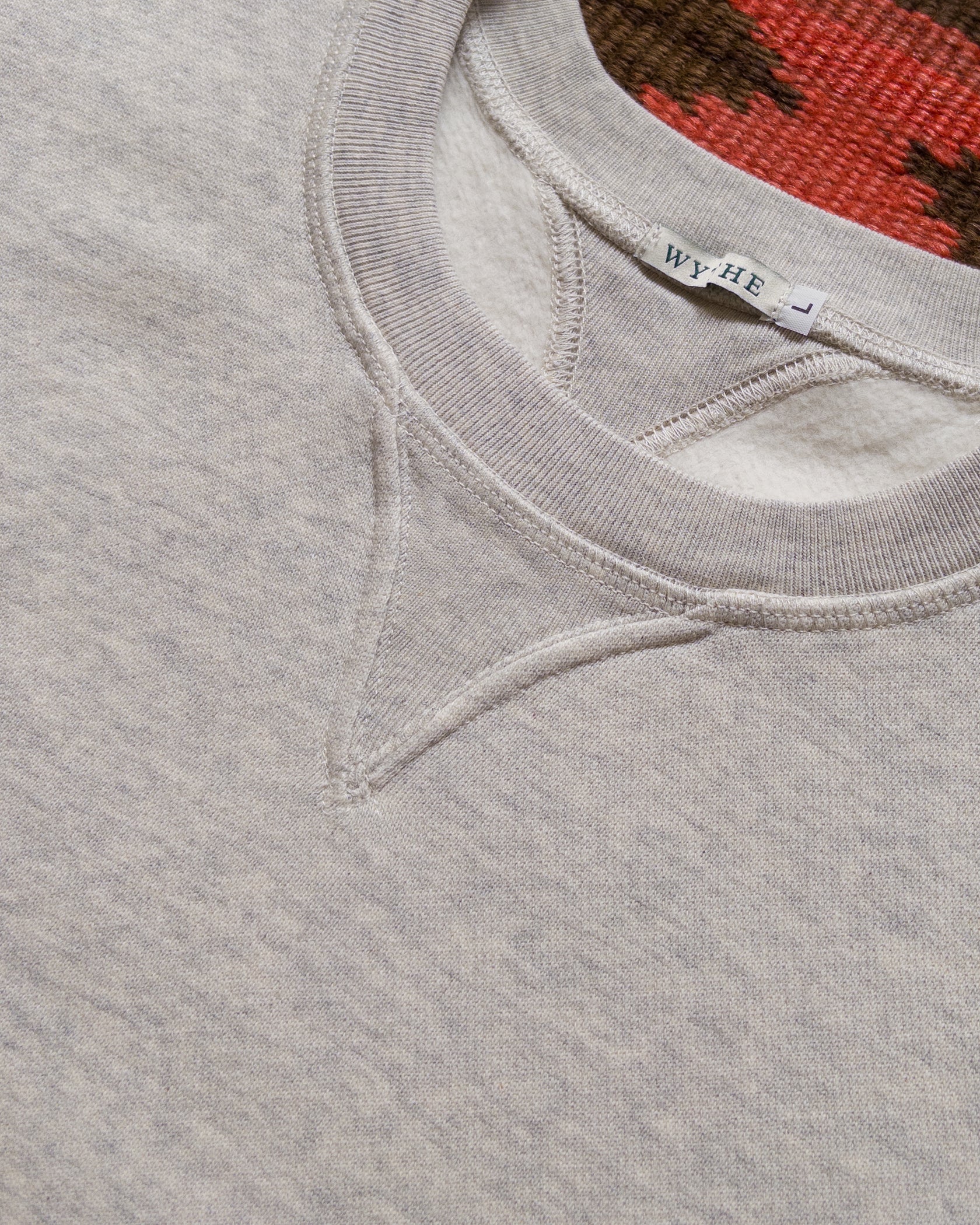 Cotton Sweatshirts were first used as athletic garments in the 1920s and 30s and always featured full length ribknit cuffs and hems, and V-shaped inserts in the neckline. The Wythe Sweatshirt stays true to these details, and adds a subtle curve into the V insert (lovingly called "Doritos" by some vintage aficionados) that gracefully matches the curve of the neckline.

Our crewneck sweatshirt has been a Wythe staple from the very beginning and was one of our earliest products. White we really loved the slimm