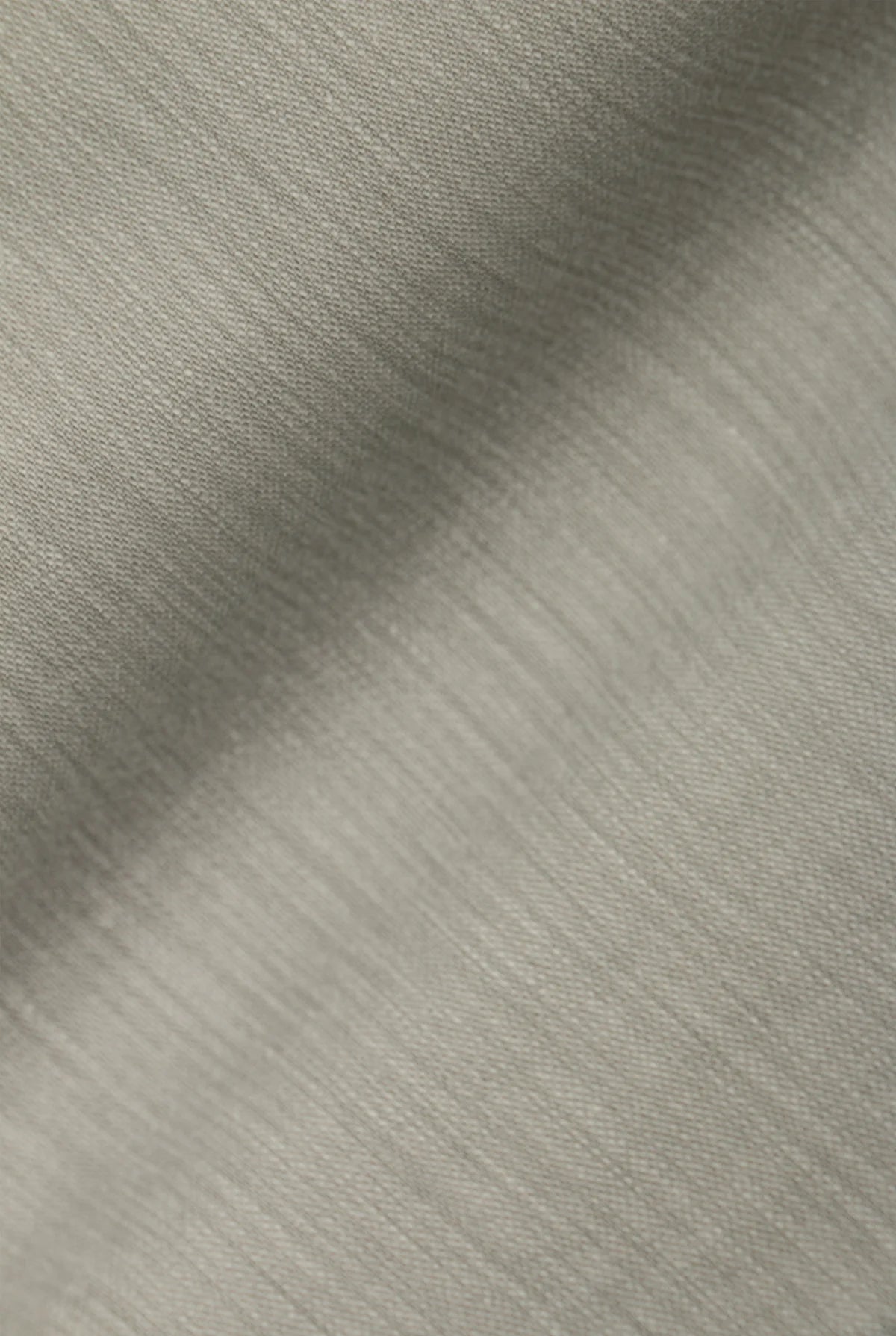 Our Surplus Pants are cut from our custom vintage dobby fabric, featuring the slub side for subtle texture. The relaxed silhouette offers comfort without compromising structure. Stone-washed for added softness, they feel instantly familiar—an understated staple that fits into your everyday wardrobe. Updated with a longer inseam.