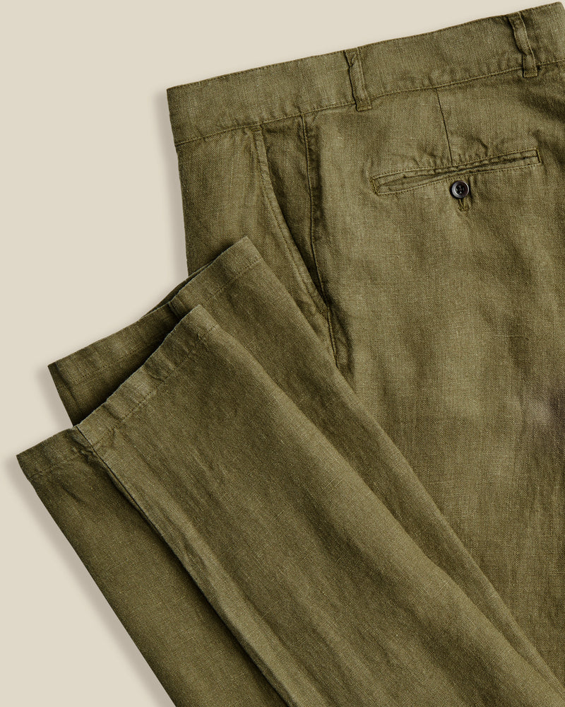 Portuguese Flannel's trousers are made from linen that's milled in Guimarães; the brand's home since 1927. Dyed navy, they're cut in a neat, straight-leg shape and have a little coin pocket by the waistband. Lower Impact Materials. This product is made using at least 50% lower-impact materials or ingredients.