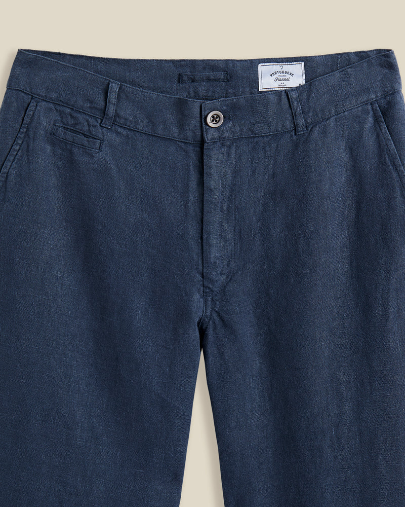 Portuguese Flannel's trousers are made from linen that's milled in Guimarães; the brand's home since 1927. Dyed navy, they're cut in a neat, straight-leg shape and have a little coin pocket by the waistband. Lower Impact Materials. This product is made using at least 50% lower-impact materials or ingredients.