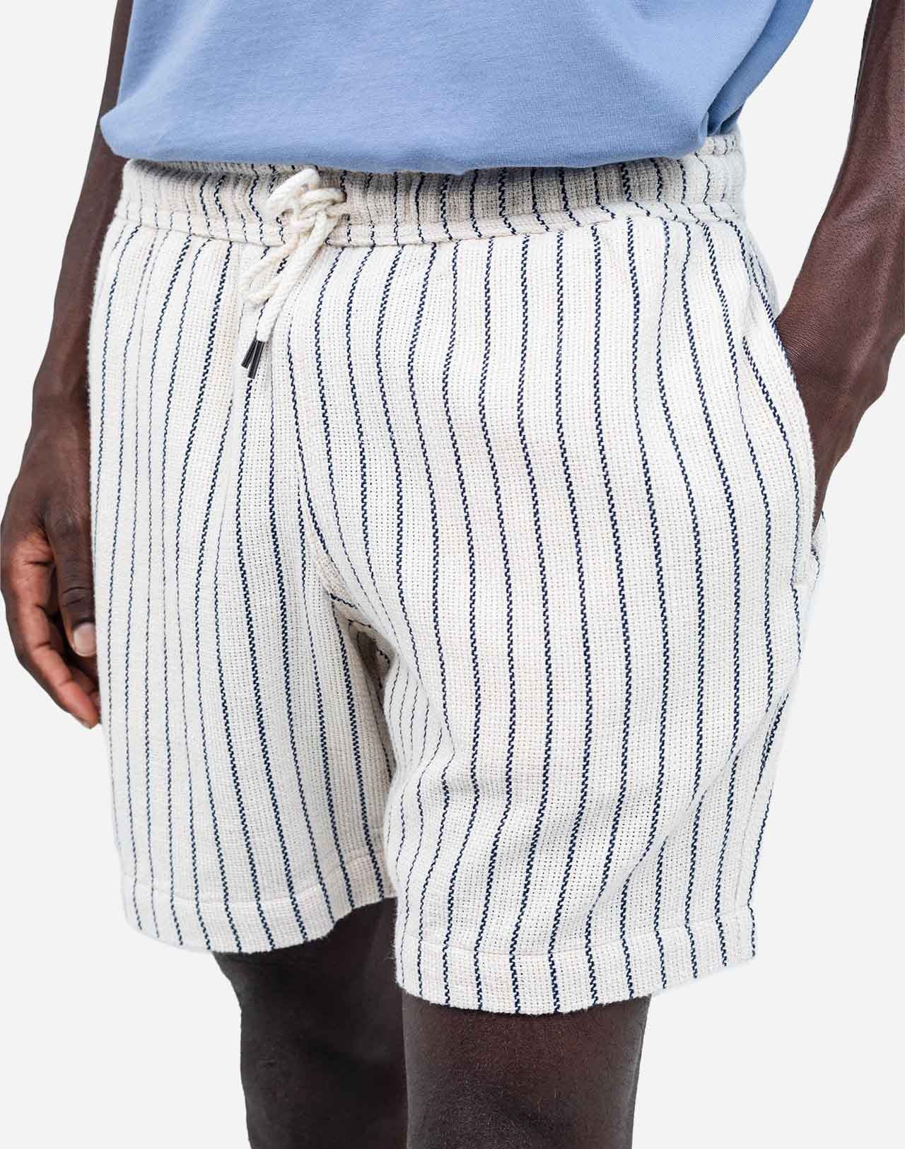 A summer wardrobe essential. With its elasticated waistband, loose fit, mid-thigh length, and soft cotton fabric enhanced by tonal topstitching, once you try the Bodhi shorts, you'll never look back (and they come in several colors and materials, for almost every day of the week).