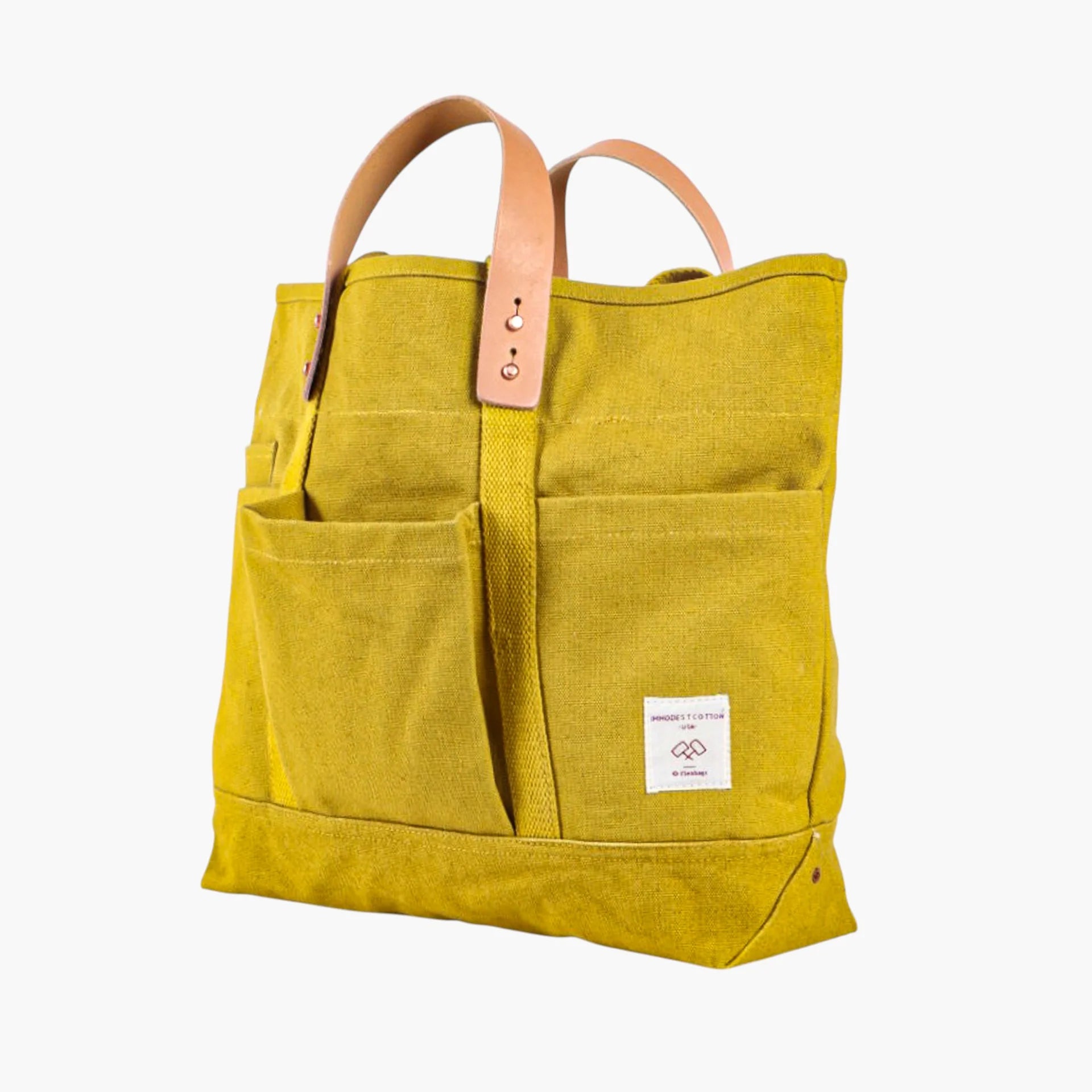 Tuck away your water bottle and keys in the front pockets, your paint brushes in the inside pocket. The Construction Tote is the same size as our Small East West Tote but with more hiding places.

• Converts from handheld to shoulder with detachable leather handles
• Once the handles are removed, the tote is washable
• All seams are double stitched and bound with cotton on the inside
• Two interior pockets and three exterior pockets
• Leather handles will patina over time with exposure to the sun and the oi